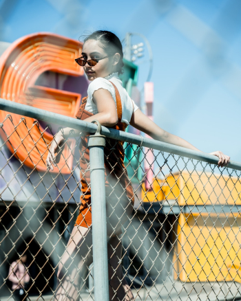 Woman Holding on Chain Link