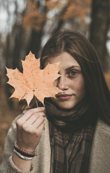 Woman Holding Orange Maple Leaf Woman Holding Orange Maple Leaf