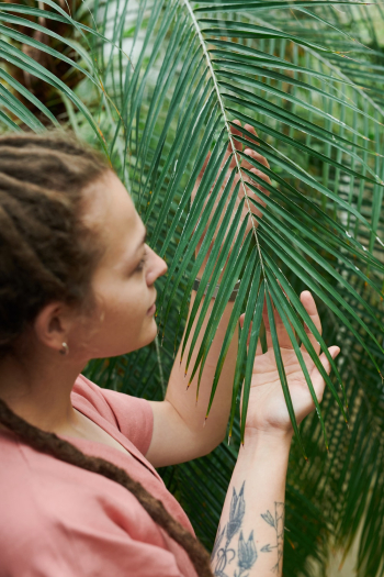 Woman Holding Palm leaves