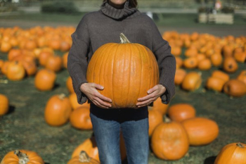 Woman Holding Perfect Pumpkin Woman Holding Perfect Pumpkin