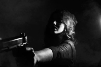 woman holding pistol woman holding pistol