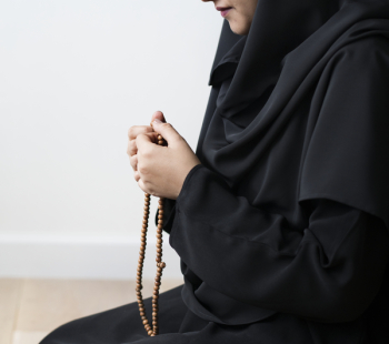Woman Holding Prayer Beads