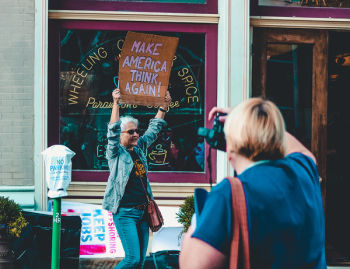Woman Holding Protest Sign Woman Holding Protest Sign