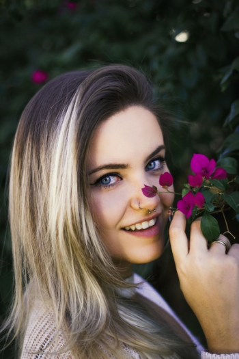 Woman Holding Purple Bougainvillea