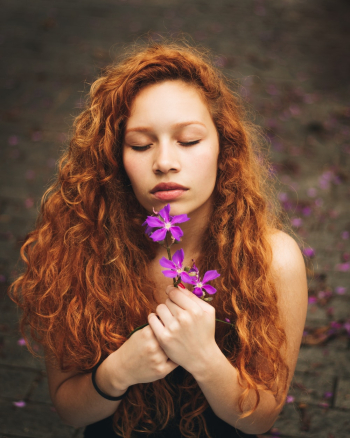 Woman Holding Purple Flowers Woman Holding Purple Flowers