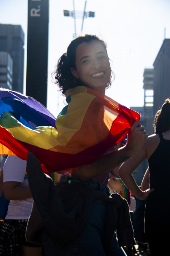 Woman Holding Rainbow Flag Woman Holding Rainbow Flag
