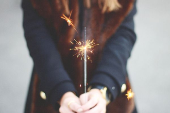 woman holding spark woman holding spark