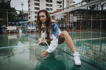 woman holding tennis racket