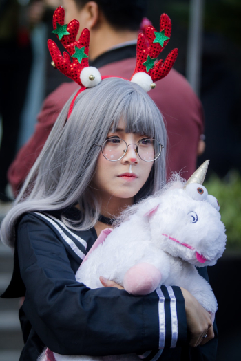 Woman Holding Unicorn Plush Toy Woman Holding Unicorn Plush Toy