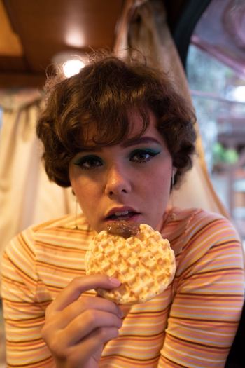 Woman Holding Waffle Inside Room Woman Holding Waffle Inside Room