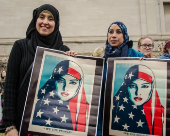 woman holding We The People posters woman holding We The People posters