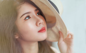 Woman Holding White Hat Woman Holding White Hat