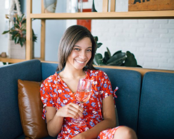 Woman Holding Wine Glass Sitting in Sofa Woman Holding Wine Glass Sitting in Sofa