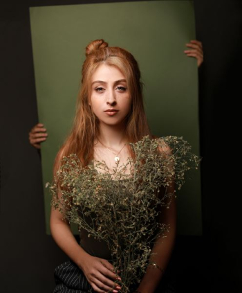 woman holding withered plants woman holding withered plants
