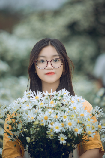 Woman Holds Bouquet of Flowers Woman Holds Bouquet of Flowers