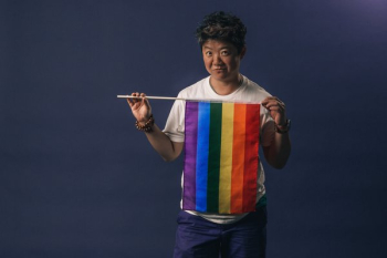 Woman Holds Pride Flag And Smirks Woman Holds Pride Flag And Smirks