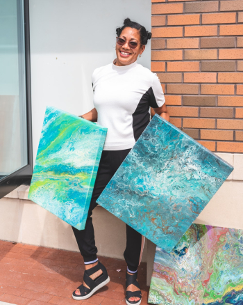 Woman Holds Two Abstract Canvas Paintings Woman Holds Two Abstract Canvas Paintings