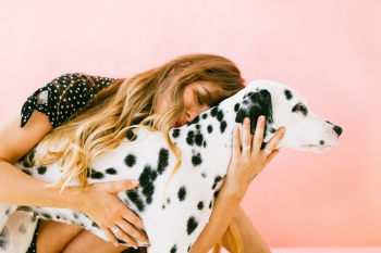 Woman Hugging Adult Dalmatian Woman Hugging Adult Dalmatian