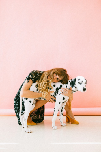 Woman Hugging Dalmatian Woman Hugging Dalmatian