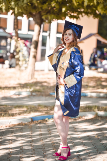 Woman In A Blue And Yellow Graduation Toga Woman In A Blue And Yellow Graduation Toga