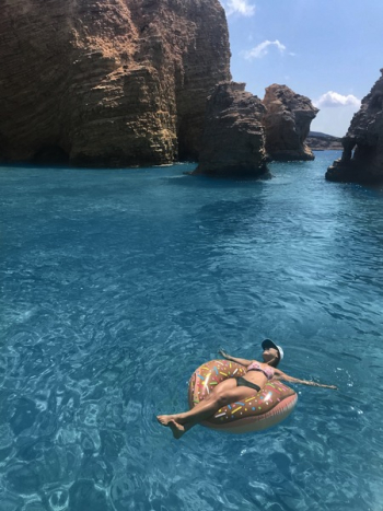 Woman in Bikini on Donut Float Under Blue Sky