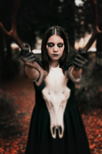 Woman in Black Dress Holding Animal Skull Woman in Black Dress Holding Animal Skull