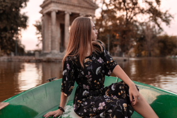Woman in Black Dress Riding Boat Woman in Black Dress Riding Boat