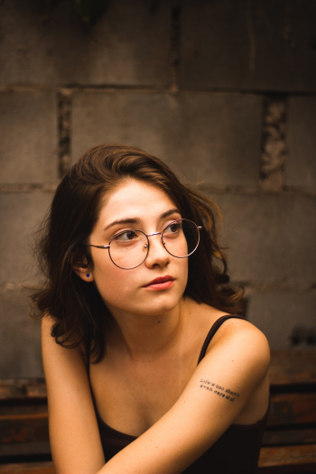 Woman In Black Tank Top Wearing Eyeglasses Woman In Black Tank Top Wearing Eyeglasses