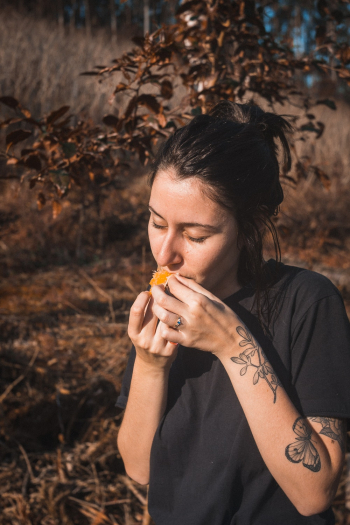 Woman in Black Top Eating 