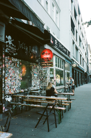 Woman in Black Top Sitting on Bench Beside Table Woman in Black Top Sitting on Bench Beside Table