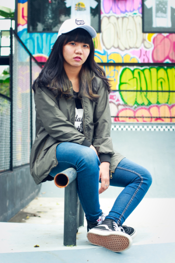 Woman in Black Zip-up Jacket Sit on Black Metal Rail Woman in Black Zip-up Jacket Sit on Black Metal Rail