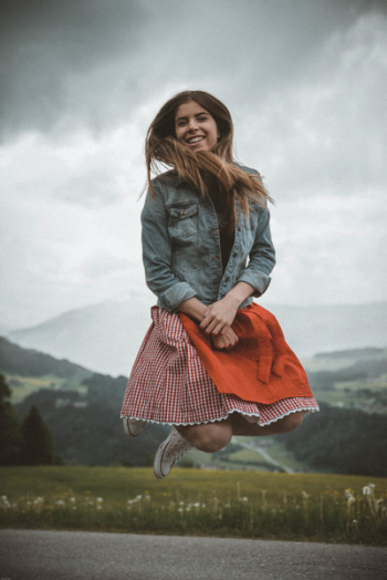 Woman in Blue Denim Jacket Jumping Woman in Blue Denim Jacket Jumping