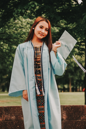 Woman in Graduation Gown Smiling Woman in Graduation Gown Smiling
