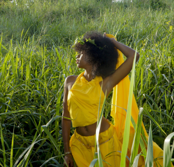 Woman In Grass Field