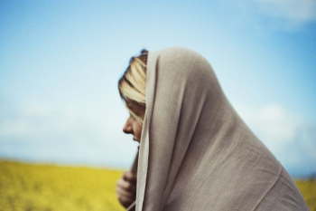 woman in gray headdress on grass field in fashion photography woman in gray headdress on grass field in fashion photography