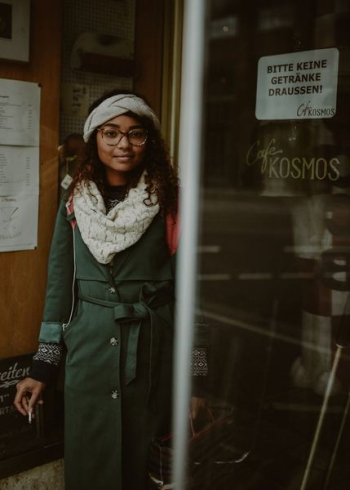 woman in green trench coat in shallow focus lens woman in green trench coat in shallow focus lens