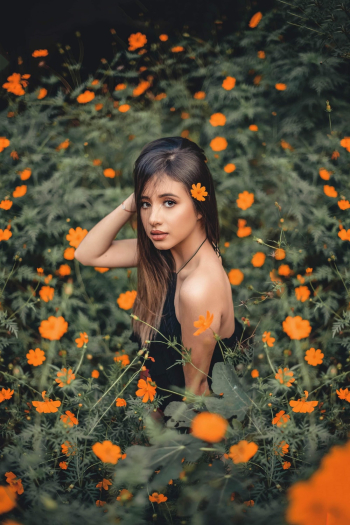 Woman in Orange Flower Field Woman in Orange Flower Field