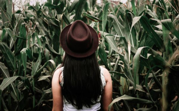 woman in photo shoot with plants background woman in photo shoot with plants background