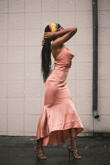 Woman in Pink Dress Hold Hair Woman in Pink Dress Hold Hair