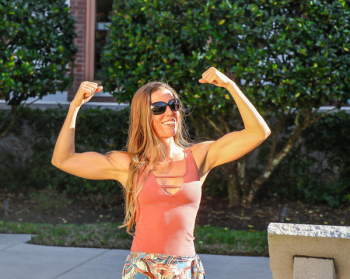 Woman in Pink Tank Top Showing Her Biceps Woman in Pink Tank Top Showing Her Biceps
