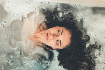 Woman in White Dress in Bath Tub Woman in White Dress in Bath Tub