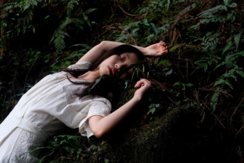 woman in white dress lying in white dress woman in white dress lying in white dress