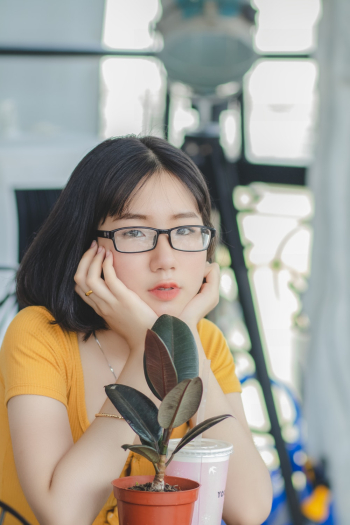 Woman in Yellow Scoop Neck Shirt and Black Framed Eyeglasses Woman in Yellow Scoop Neck Shirt and Black Framed Eyeglasses