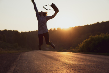 Woman Jumped on Gray Asphalt Road Woman Jumped on Gray Asphalt Road