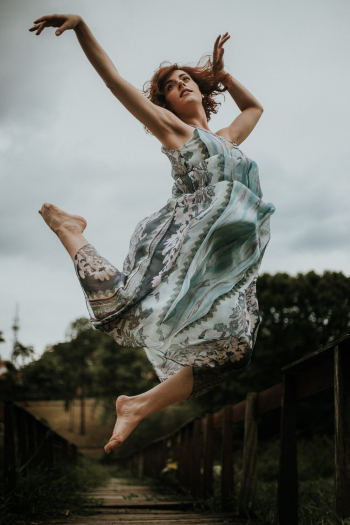 Woman Jumping Wearing Green Woman Jumping Wearing Green