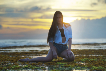 Woman Kneeling on Grass
