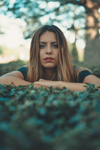 Woman Laying On Grass