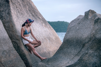 Woman Leaning on Large Rock Woman Leaning on Large Rock