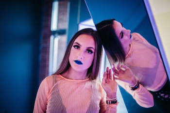 woman leaning on mirror woman leaning on mirror
