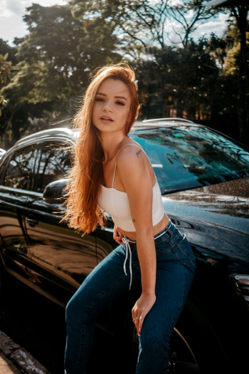 Woman Leaning on Vehicle Woman Leaning on Vehicle